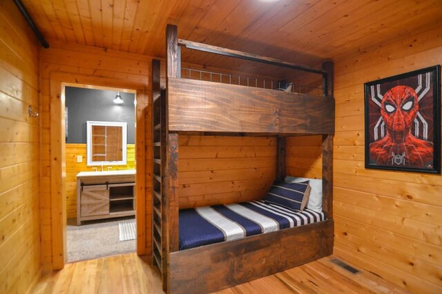 2837 Cedar Falls Way, Sevierville, TN 37862 - bedroom with wood finished floors, wooden walls, and wooden ceiling