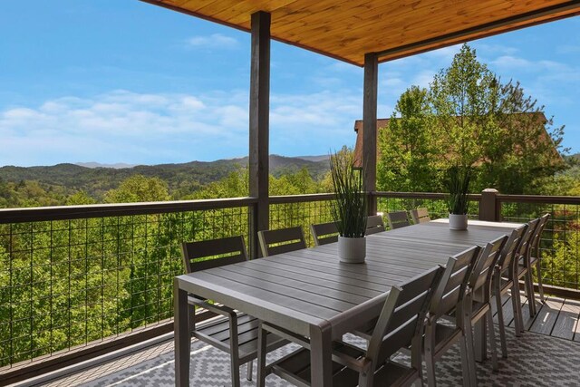 2837 Cedar Falls Way, Sevierville, TN 37862 - wooden terrace with outdoor dining area and a mountain view