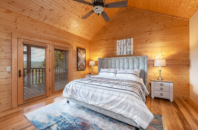 2837 Cedar Falls Way, Sevierville, TN 37862 - bedroom featuring access to exterior, wood walls, lofted ceiling, wooden ceiling, and wood finished floors