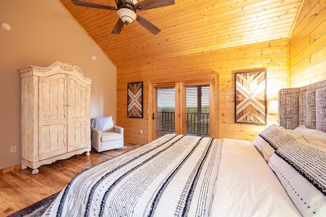 2837 Cedar Falls Way, Sevierville, TN 37862 - bedroom featuring wood finished floors, wooden walls, access to exterior, and high vaulted ceiling