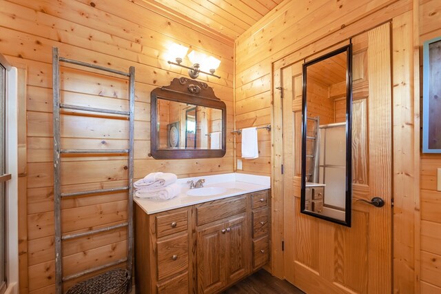 2837 Cedar Falls Way, Sevierville, TN 37862 - bathroom with wooden walls, wooden ceiling, and vanity