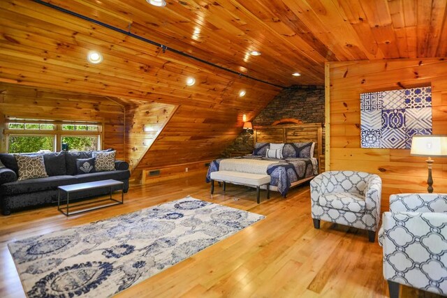 2837 Cedar Falls Way, Sevierville, TN 37862 - living room with lofted ceiling, wooden walls, wood ceiling, and hardwood / wood-style floors
