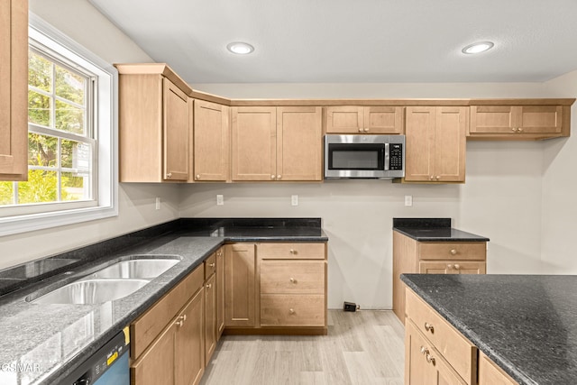 1039 Cedar Ln, Sevierville, TN 37862 - kitchen with stainless steel microwave, dishwasher, dark stone counters, light wood finished floors, and recessed lighting