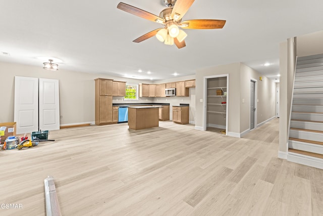 1039 Cedar Ln, Sevierville, TN 37862 - unfurnished living room featuring stairway, ceiling fan, light wood-style floors, and recessed lighting