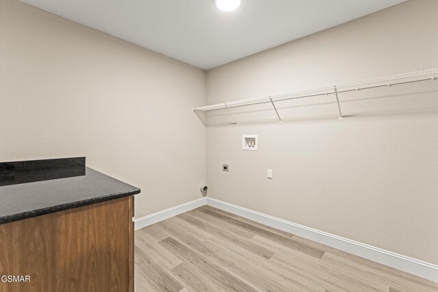 1039 Cedar Ln, Sevierville, TN 37862 - washroom with hookup for an electric dryer, washer hookup, and light wood-style flooring