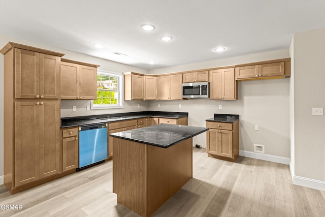 1039 Cedar Ln, Sevierville, TN 37862 - kitchen featuring dishwashing machine, stainless steel microwave, light wood-type flooring, a kitchen island, and recessed lighting