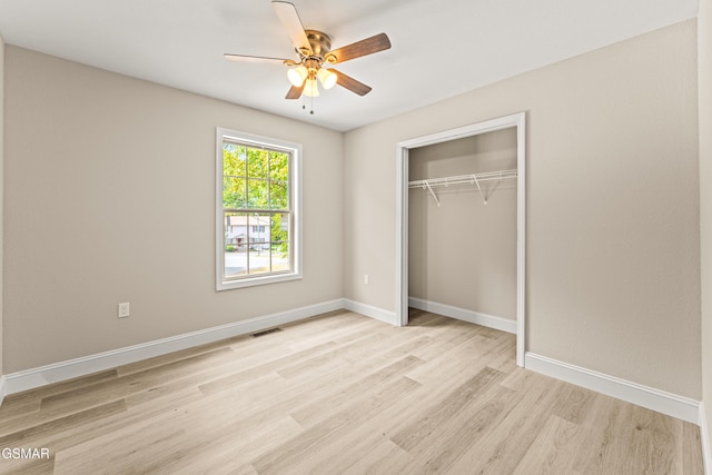 1039 Cedar Ln, Sevierville, TN 37862 - unfurnished bedroom featuring light wood-style floors, a closet, and a ceiling fan