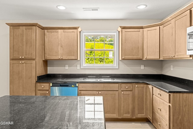 1039 Cedar Ln, Sevierville, TN 37862 - kitchen featuring stainless steel dishwasher, dark stone counters, recessed lighting, and light wood-style flooring