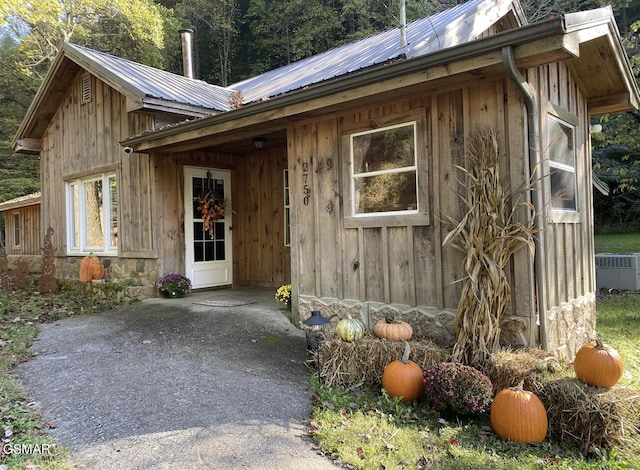 doorway to property featuring cooling unit