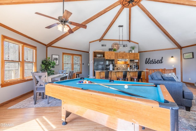 game room featuring pool table, light wood-style flooring, a wealth of natural light, and crown molding