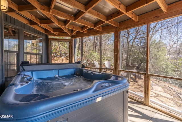 sunroom / solarium featuring a hot tub