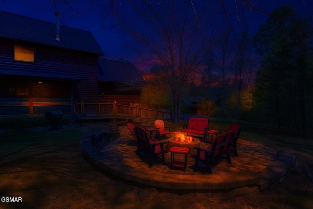 2754 Owls Cove Way, Sevierville, TN 37862 - patio at twilight with a fire pit, a wooden deck, and a patio area