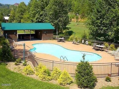 2754 Owls Cove Way, Sevierville, TN 37862 - community pool with a patio area