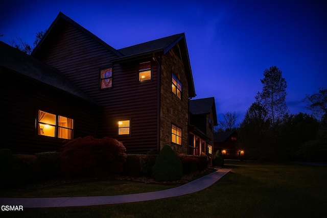 2754 Owls Cove Way, Sevierville, TN 37862 - view of side of home with stone siding, faux log siding, and a lawn