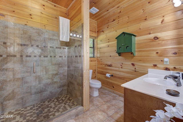 2754 Owls Cove Way, Sevierville, TN 37862 - bathroom with vanity, a stall shower, wooden walls, and tile patterned flooring