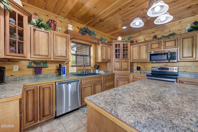 2754 Owls Cove Way, Sevierville, TN 37862 - kitchen featuring stainless steel appliances, light tile patterned flooring, wood ceiling, brown cabinets, and decorative light fixtures