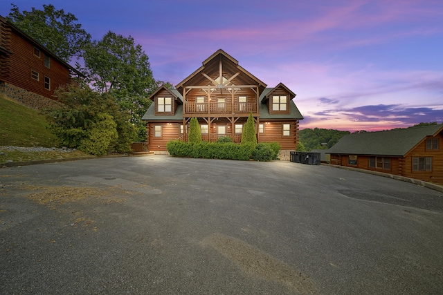2857 White Oak Ridge Ln, Sevierville, TN 37862 - log cabin with log siding, a balcony, and driveway