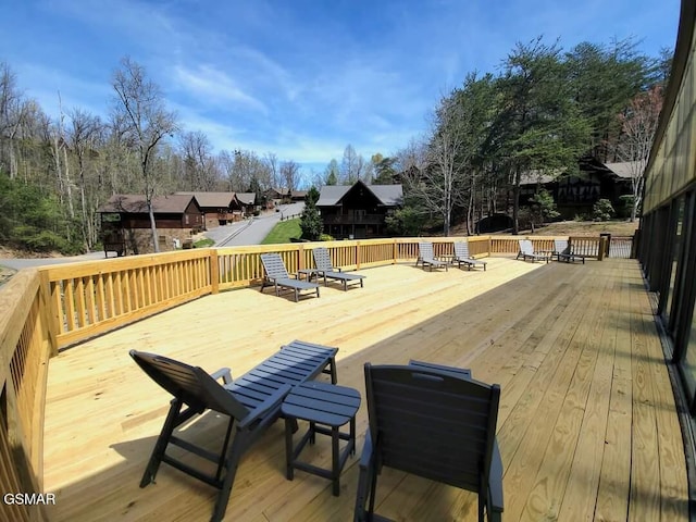 wooden terrace with a residential view