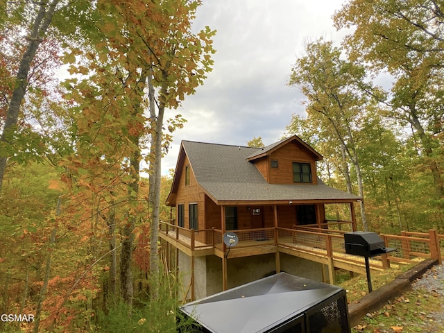 back of property featuring a balcony