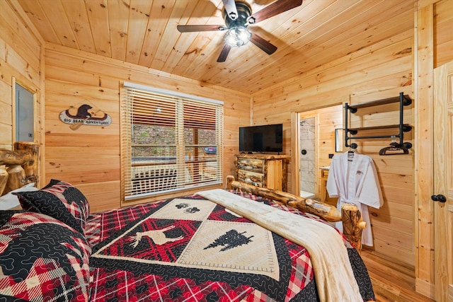 bedroom with wood ceiling, ceiling fan, wooden walls, and hardwood / wood-style flooring