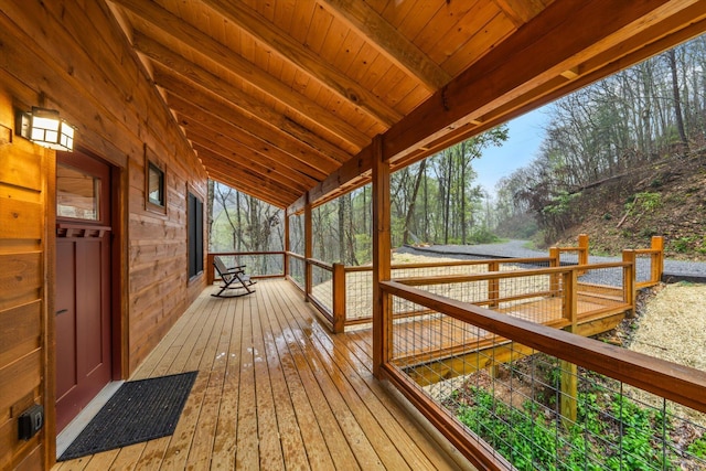 wooden terrace featuring covered porch