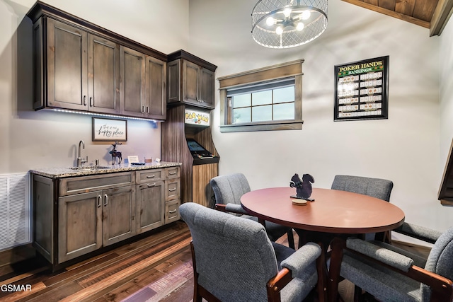 710 Wiley Oakley Dr, Gatlinburg, TN 37738 - dining space with dark wood-style floors and wet bar