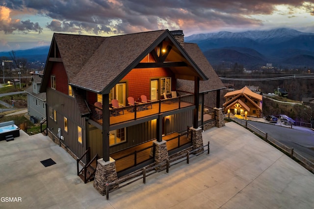 710 Wiley Oakley Dr, Gatlinburg, TN 37738 - view of front of property with a shingled roof, a balcony, a mountain view, and a chimney