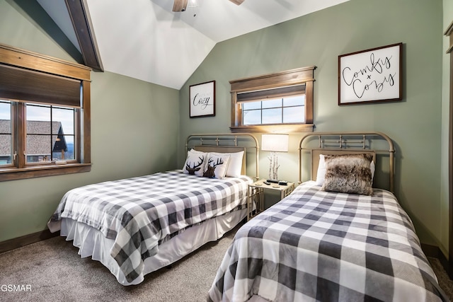 710 Wiley Oakley Dr, Gatlinburg, TN 37738 - carpeted bedroom featuring multiple windows, vaulted ceiling, baseboards, and a ceiling fan