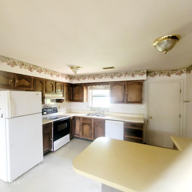 167 Vanderview Dr, Seymour, TN 37865 - kitchen featuring white appliances, under cabinet range hood, dark brown cabinets, light countertops, and light floors