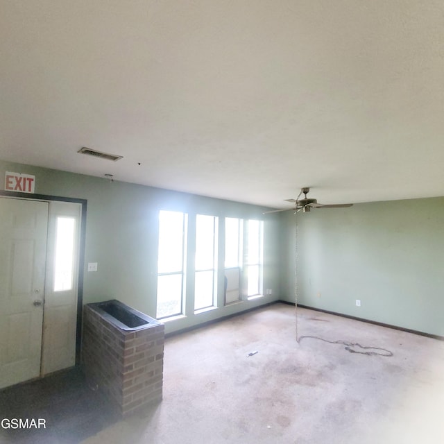 167 Vanderview Dr, Seymour, TN 37865 - unfurnished living room with plenty of natural light, ceiling fan, and concrete floors