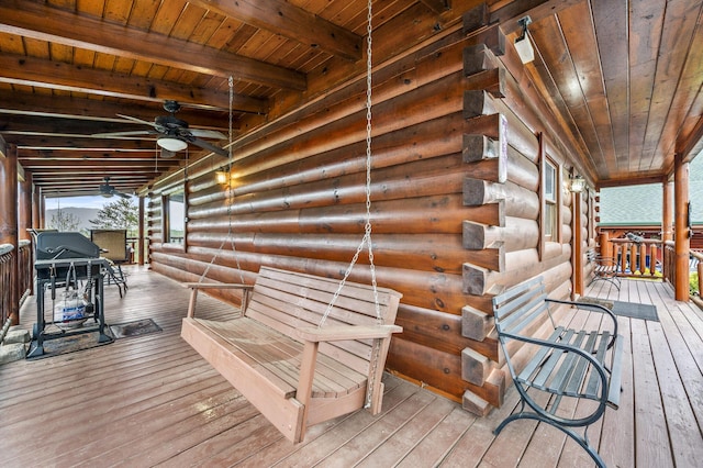 wooden terrace featuring ceiling fan