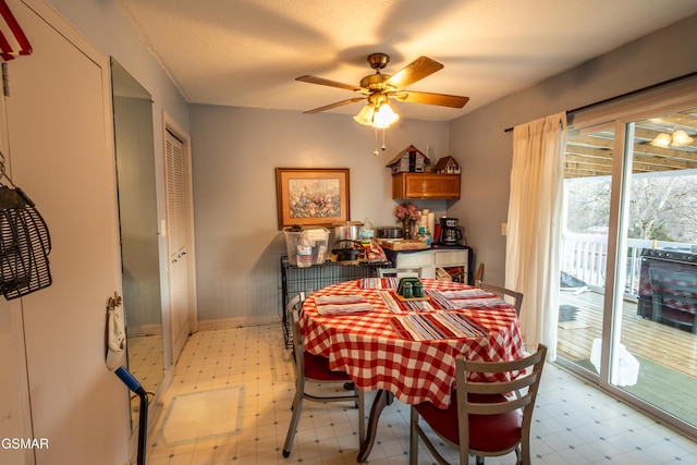 dining area featuring a textured ceiling and ceiling fan