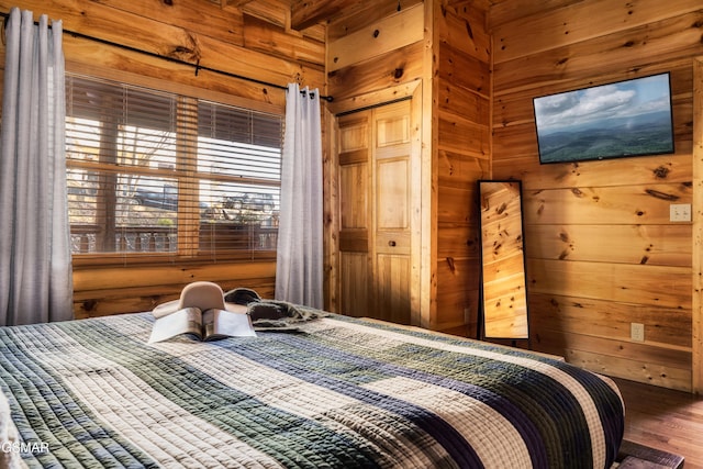 2017 Smoky Cove Rd, Sevierville, TN 37876 - bedroom with wood walls, wood finished floors, and a closet