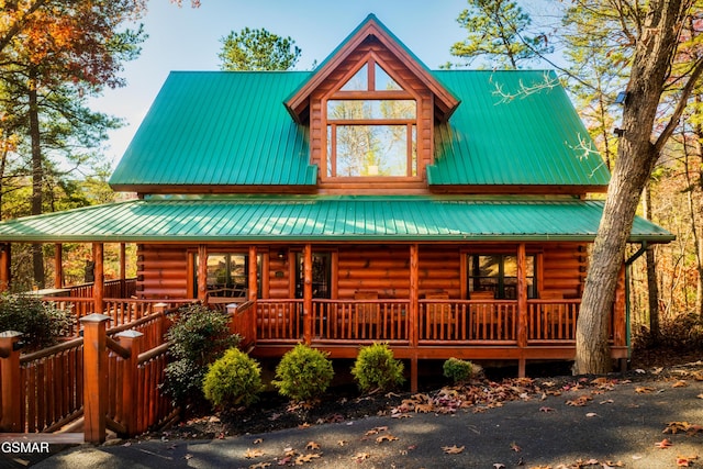 2017 Smoky Cove Rd, Sevierville, TN 37876 - cabin featuring covered porch, log exterior, and metal roof
