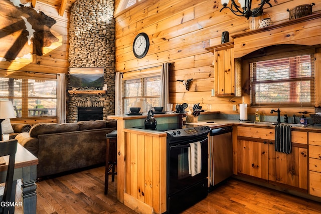 2017 Smoky Cove Rd, Sevierville, TN 37876 - kitchen featuring black / electric stove, a sink, stainless steel dishwasher, dark wood-style floors, and a fireplace