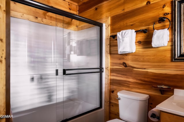 2017 Smoky Cove Rd, Sevierville, TN 37876 - bathroom featuring an enclosed shower, toilet, vanity, and wood walls