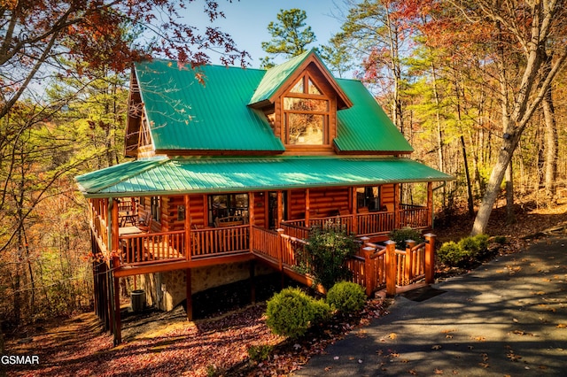 2017 Smoky Cove Rd, Sevierville, TN 37876 - view of front of property featuring a porch, log siding, and metal roof