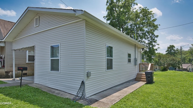 1625 Worth St, Knoxville, TN 37917 - view of side of property featuring a yard and a patio area