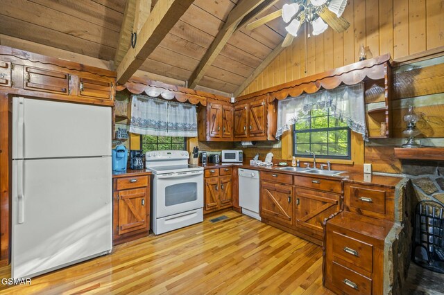 kitchen featuring light wood-type flooring, wood ceiling, white appliances, sink, and lofted ceiling with beams