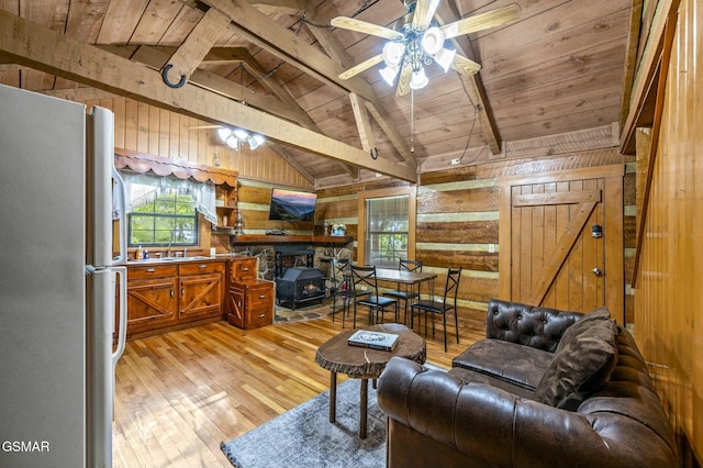 living room featuring ceiling fan, sink, light hardwood / wood-style flooring, wooden ceiling, and wood walls