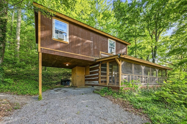 view of front of home featuring a sunroom