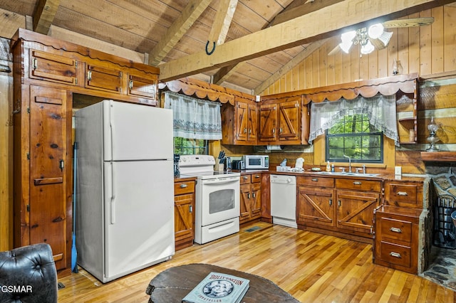 kitchen with white appliances, wooden ceiling, lofted ceiling with beams, sink, and light wood-type flooring