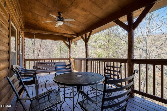 wooden deck featuring a ceiling fan