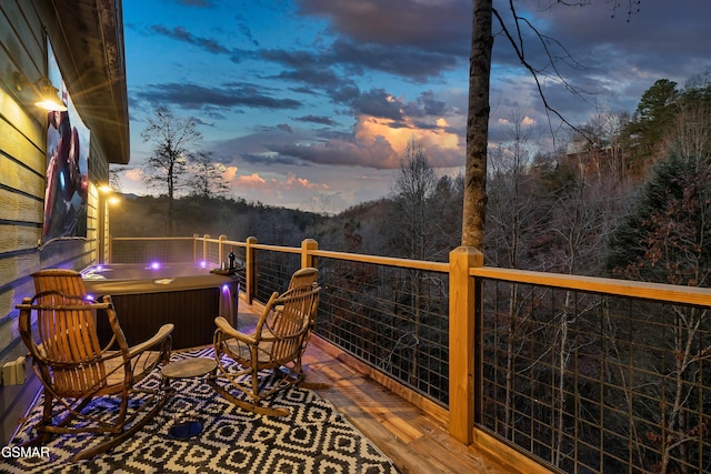 1719 Walker Trl, Sevierville, TN 37876 - deck at dusk featuring a hot tub