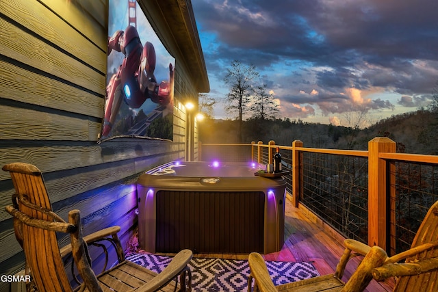 1719 Walker Trl, Sevierville, TN 37876 - deck at dusk featuring a hot tub