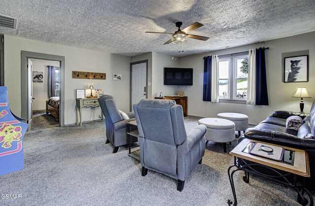 2589 Ridge Rd, Pigeon Forge, TN 37863 - living area with ceiling fan, light carpet, and a textured ceiling