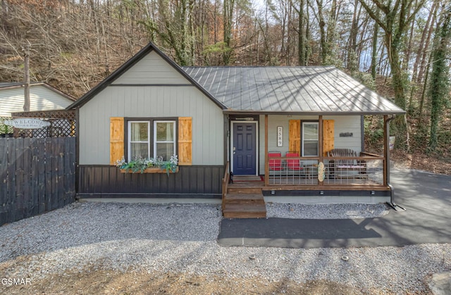 2589 Ridge Rd, Pigeon Forge, TN 37863 - view of front facade with covered porch, metal roof, and a standing seam roof
