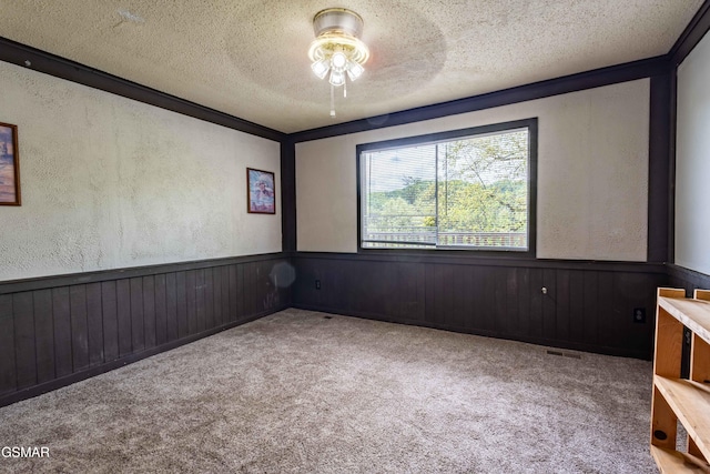 1721 Birch Dr # A1, Sevierville, TN 37876 - carpeted spare room with a wainscoted wall, ceiling fan, a textured wall, visible vents, and a textured ceiling