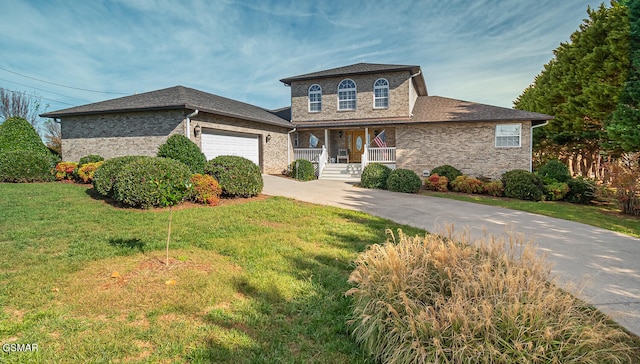 150 Florence Cir, Dandridge, TN 37725 - view of front of home featuring covered porch, a garage, and a front yard