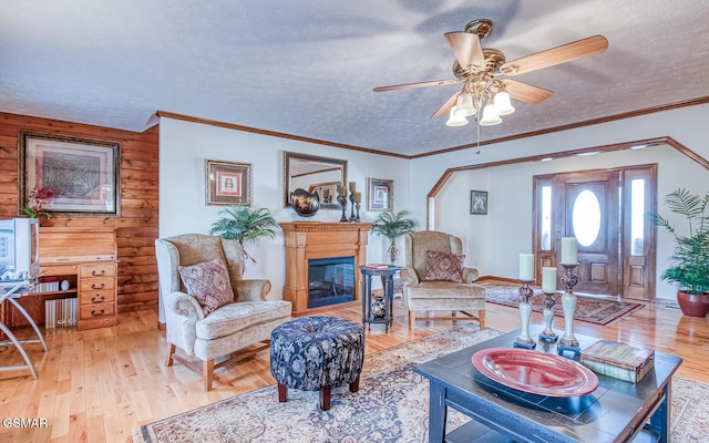 150 Florence Cir, Dandridge, TN 37725 - living room with hardwood / wood-style floors, a textured ceiling, ceiling fan, and wooden walls
